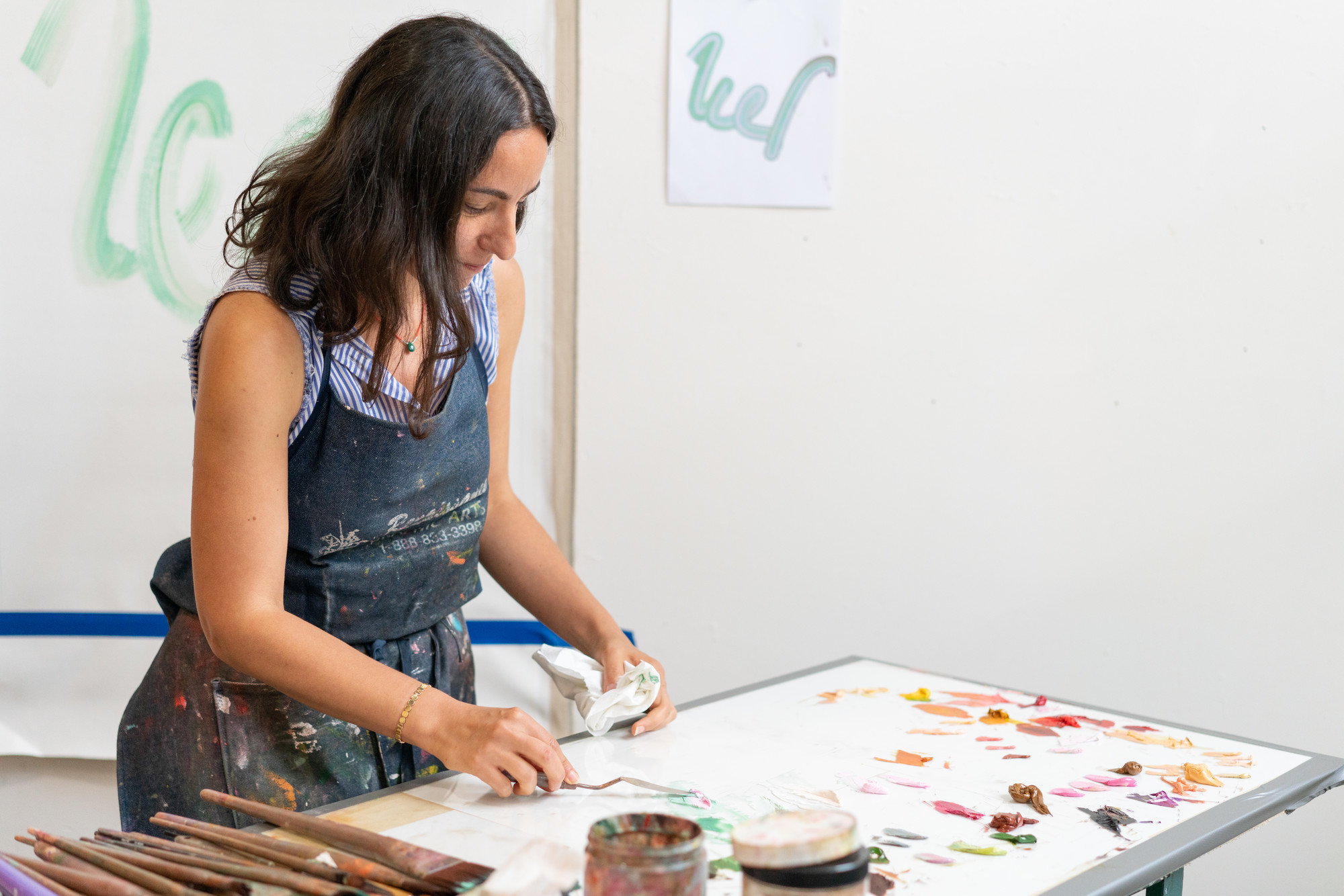 Photograph of an artist at work in the Assets for Artists studio program.
