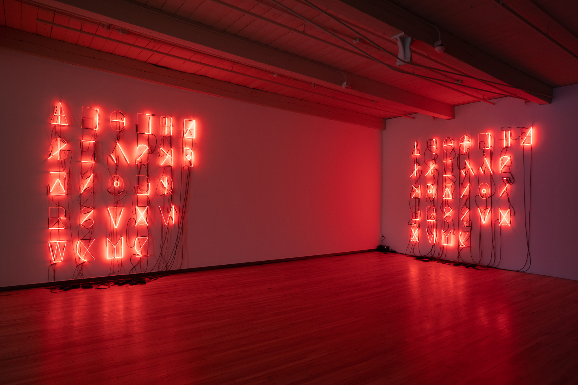 Photograph of Aslı Çavuşoğlu works as installed in the exhibition 'Kissing through a Curtain' at MASS MoCA.